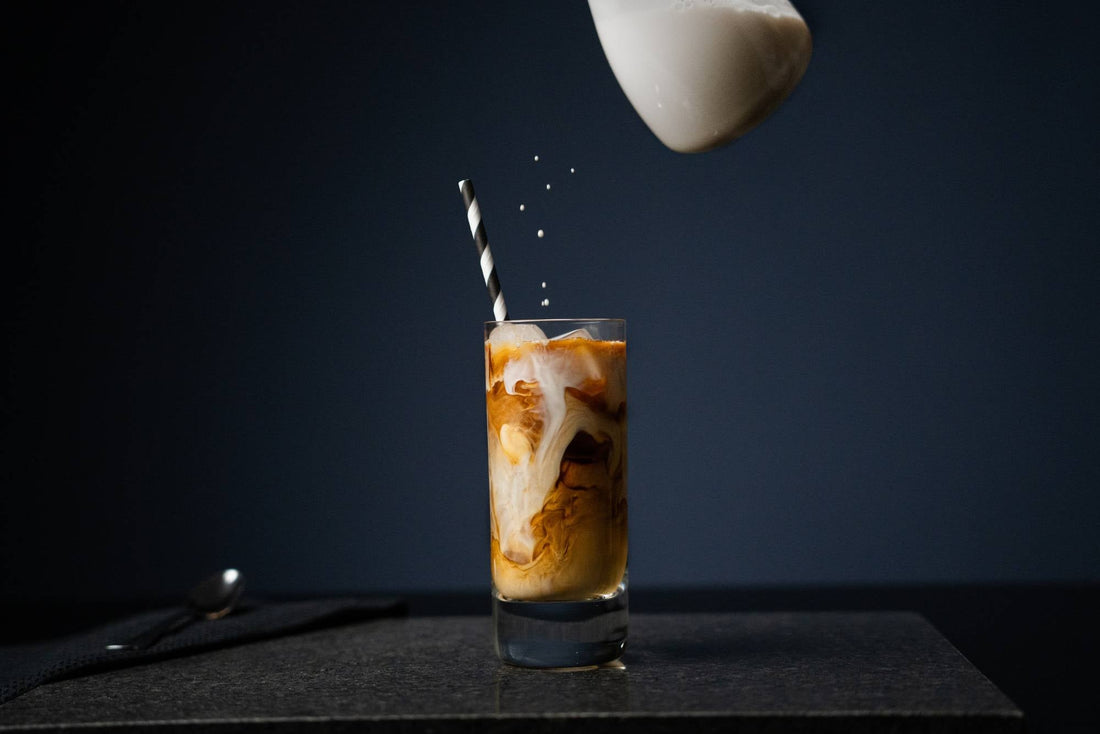 cold brew coffee pouring into glass