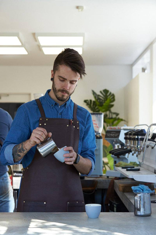 Coffee Barista pouring a coffee
