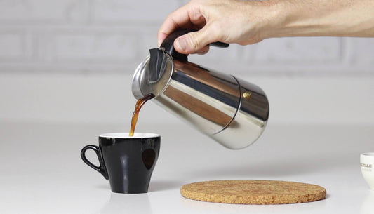 pouring coffee at home into cup||home coffee brewer lined up on bench|aeropress brew guide|clever coffee dripper brew guide|coffee plunger french press brew guide|stovetop espresso moka brew guide