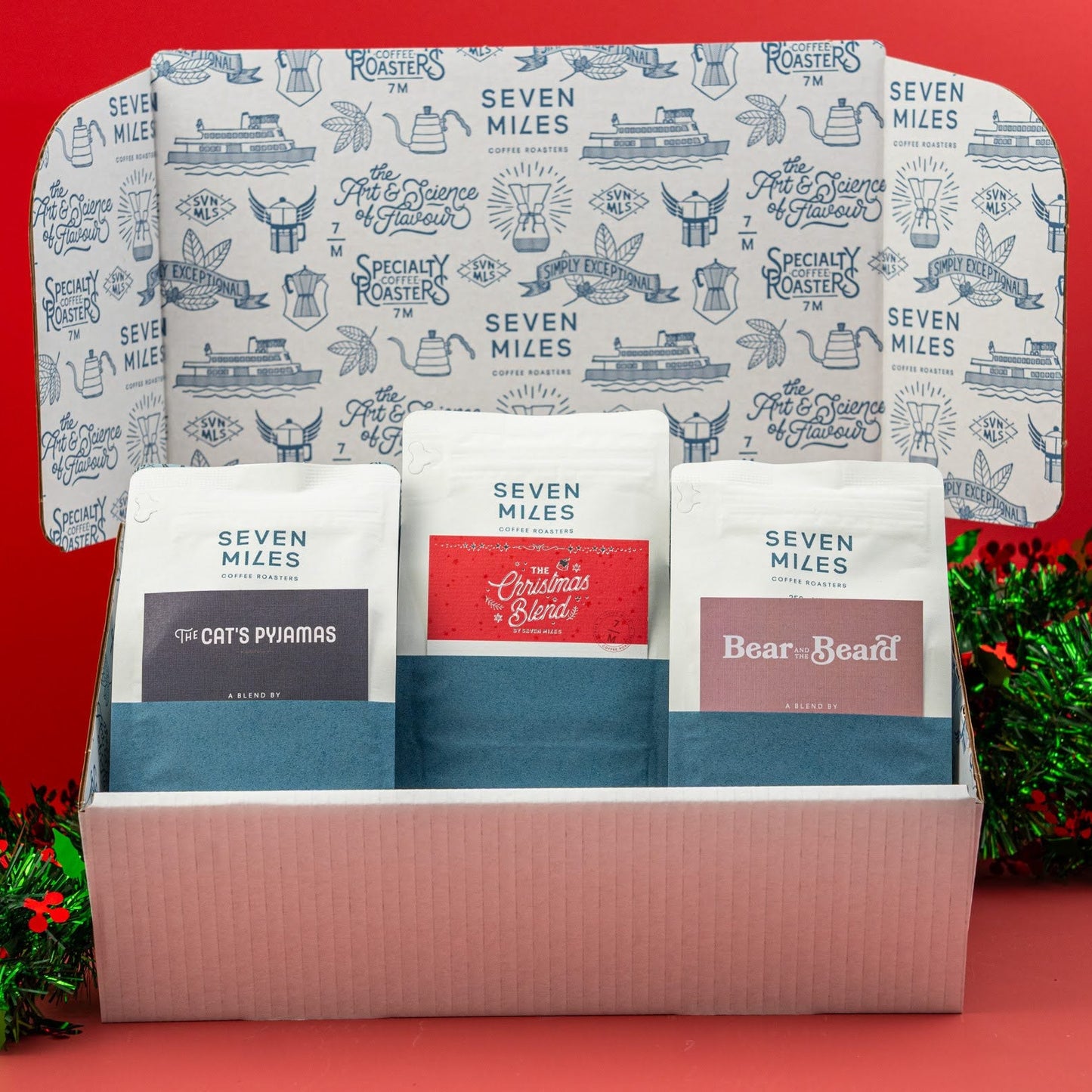 A Christmas sampler pack from Seven Miles Coffee Roasters, the perfect gift for coffee lovers, containing 3 x 250 GR bags; The Catt's Pyjamas, Bear and The beard and the limited edition The Christmas Blend