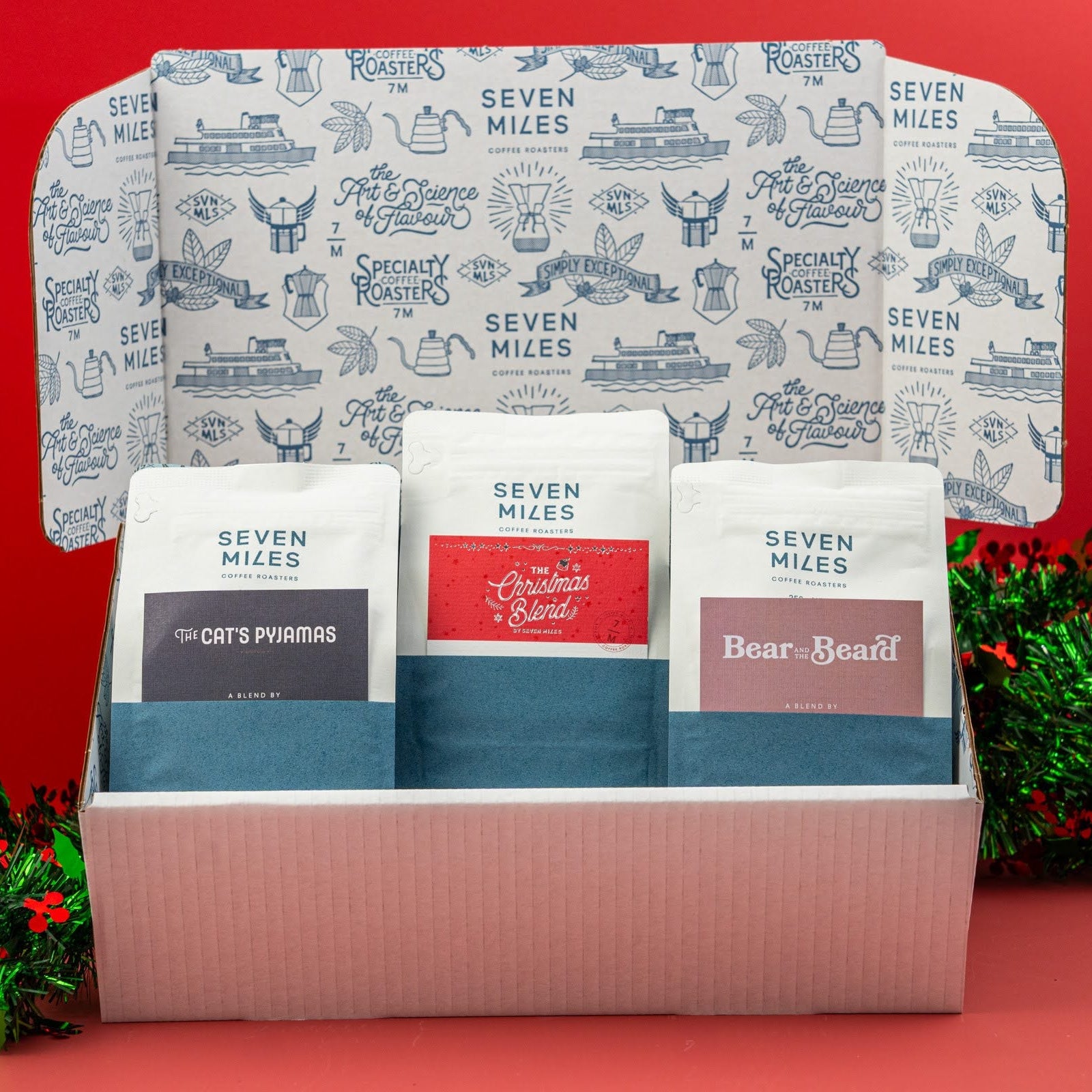 A Christmas sampler pack from Seven Miles Coffee Roasters, the perfect gift for coffee lovers, containing 3 x 250 GR bags; The Catt's Pyjamas, Bear and The beard and the limited edition The Christmas Blend